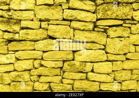 Yellow stone wall. Texture, background Stock Photo