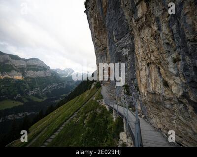 Famous guesthouse Aescher-Wildkirchli built into limestone cliff wall Alpstein alpine mountains Appenzell Innerrhoden Switzerland Stock Photo