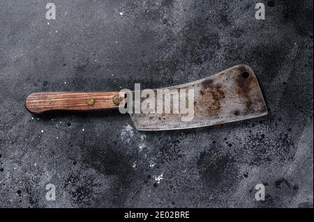 Vintage butcher cleaver with wooden handle. Black background. Top view Stock Photo