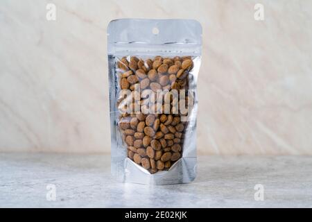 Packed Dog Food For Sale in Plastic Package Container. Ready to Use. Stock Photo