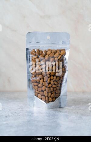 Packed Dog Food For Sale in Plastic Package Container. Ready to Use. Stock Photo