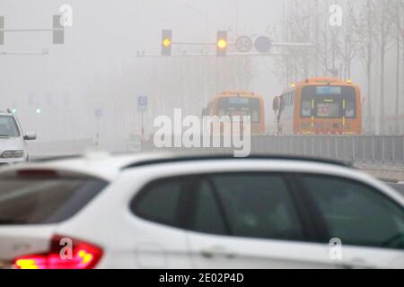 Yantai, Yantai, China. 28th Dec, 2020. Shandong, CHINA-On December 28, the visibility in most areas of Yantai city, Shandong Province, was less than 200 meters in fog, while visibility in some areas was less than 50 meters, bringing inconvenience to people's travel.The Yantai Meteorological Observatory upgraded the yellow fog warning signal to orange fog warning signal at 8:10 am Wednesday. Credit: SIPA Asia/ZUMA Wire/Alamy Live News Stock Photo