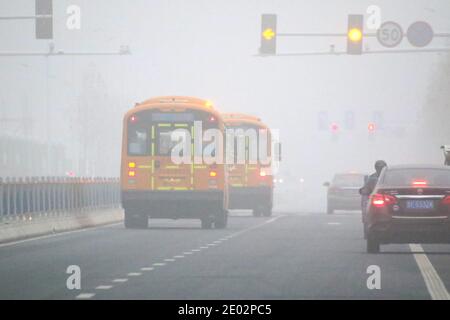 Yantai, Yantai, China. 28th Dec, 2020. Shandong, CHINA-On December 28, the visibility in most areas of Yantai city, Shandong Province, was less than 200 meters in fog, while visibility in some areas was less than 50 meters, bringing inconvenience to people's travel.The Yantai Meteorological Observatory upgraded the yellow fog warning signal to orange fog warning signal at 8:10 am Wednesday. Credit: SIPA Asia/ZUMA Wire/Alamy Live News Stock Photo