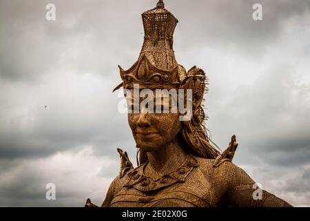 A close up image of the statue of Dewi Sri (The goddess of rice and fertility) at Jatiluwih Rice Terrace in Bali Stock Photo