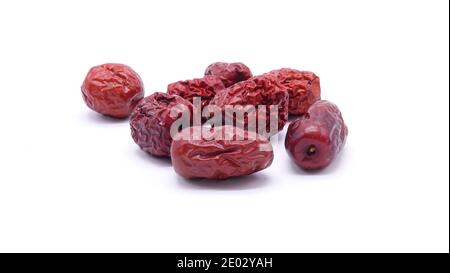 Chinese dried red dates on white background. Jujube Stock Photo