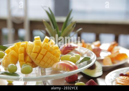 Closeup of mango cube slices in a plate, fruit salad, healthy lifestyle Stock Photo