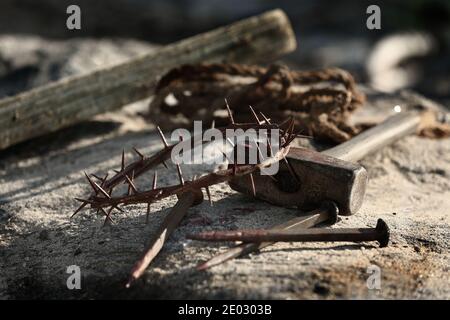Lord Jesus was crucified, hammer, nails and crown of thorns, suffering concept Stock Photo