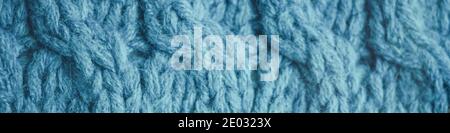 Knitted pattern of threads in blue color. Stock Photo