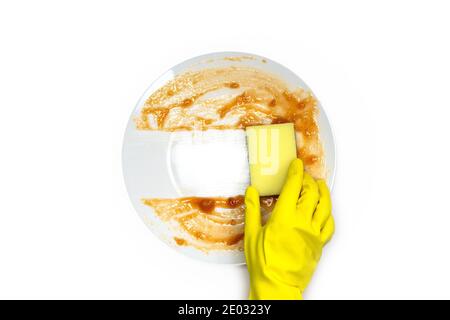 hands in rubber yellow gloves for protection washing dirty plate with foam sponge isolated on white background top view, Healthy and cleaning business Stock Photo