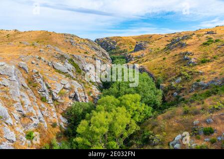 Valley of Ida Burn river at Central Otago Railway bicycle trail in New Zealand Stock Photo