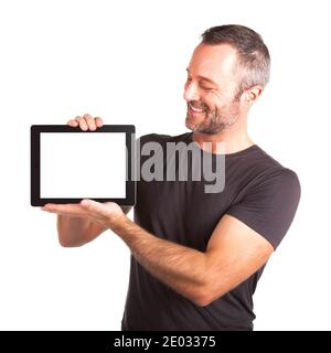 Portrait of a man displaying a blank tablet screen on white background. Stock Photo