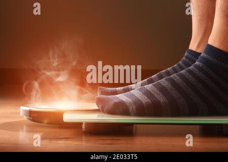 Closeup Of Man's Feet On Weight Scale Indicating Overweight Stock Photo,  Picture and Royalty Free Image. Image 33443183.