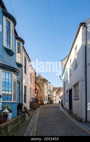 Staithes harbour, a once important fishing port, also known for its unique and colourful 'cobles' fishing boats that still fish lobster and mackeral. Stock Photo