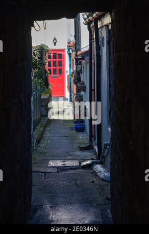 Staithes harbour, a once important fishing port, also known for its unique and colourful 'cobles' fishing boats that still fish lobster and mackeral. Stock Photo