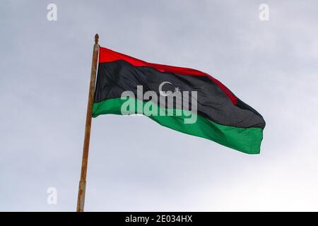 Flag of the state of Libya The flag of Libya was originally introduced in 1951, following the creation of the Kingdom of Libya. Stock Photo