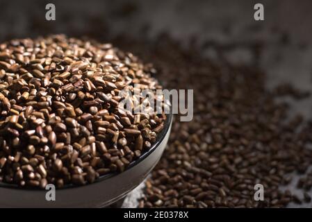 Closeup of Sicklepod, cassia tora seeds in bowl Stock Photo