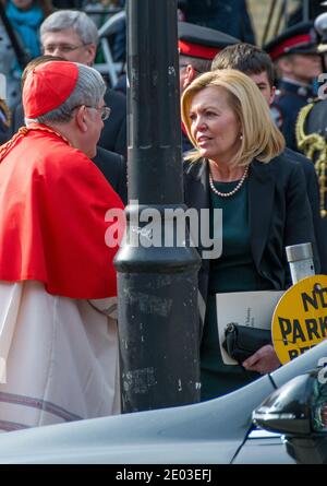 Flaherty's widow Cristine Elliott says goodbye to Cardinal Thomas Collins. Scenes of the State Funeral for Jim Flaherty, former Minister of Finance of Stock Photo