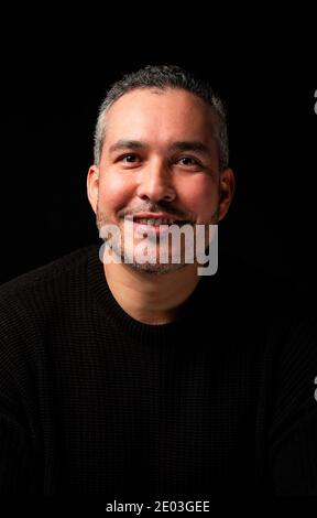 Portrair of a young man over a black background Stock Photo