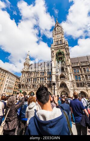 Tourists taking photographs of the carillon of New Townhall in Munich, Germany Stock Photo