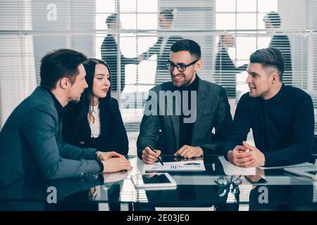 boss and business team analyzing financial data Stock Photo
