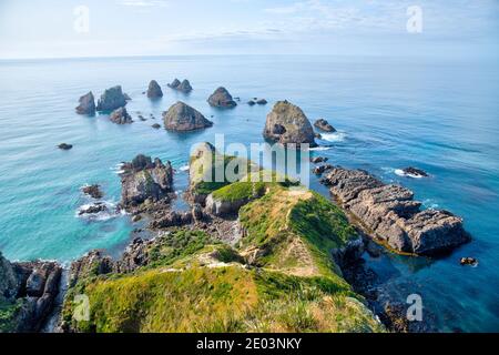 The nuggets - rocky islets at Nugget point in New Zealand Stock Photo