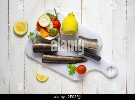 Typical Neapolitan raw fish dish of the Christmas period. Capitone, eel, cod and clams Stock Photo