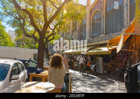 Valencia, Spain. October 11, 2020: Building of the central market of the city, with traditional street stalls for buy paella, tapas or drinks Stock Photo