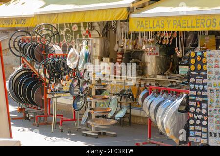 Valencia, Spain. October 11, 2020: Outside of central market. Traditional street stalls of pans for paella, and souvenirs Stock Photo