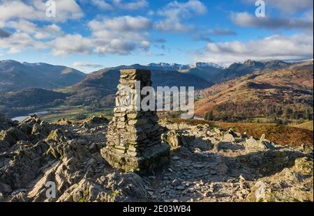 Lingmoor Fell, Crinkle Crags, Bowfell, the Langdale Pikes and Chapel Stile seen from the summit of Loughrigg Fell, Grasmere, Lake District, Cumbria Stock Photo