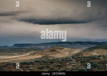 Dark clouds above an empty landscape in Owhyee, Oregon. Stock Photo