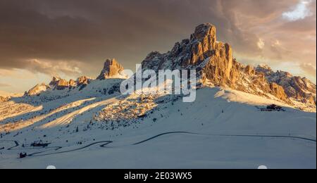 Passo Giau Italian Dolomites at sunrise with snow capped mountains Stock Photo
