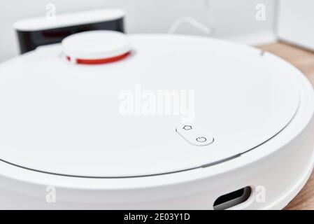 Robot vacuum cleaner return to the charge after cleaning room Modern smart household Stock Photo