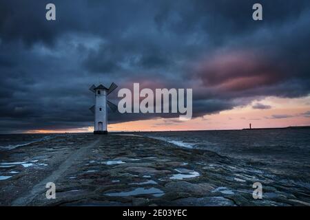 Windmill in dark sky Stock Photo