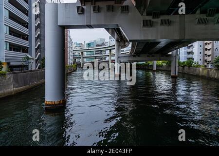 In Tokyo, the highway crosses the river at the famous Nihonbashi Bridge. The Nihonbashi Bridge in Tokyo is the starting point for all distances in Japan. Nihonbashi Bridge in Chuo, Tokyo, Japan Stock Photo