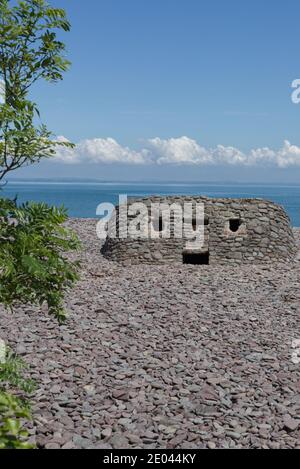 The ruins of an old World War 2 pillbox on the beach at Porlock Weir Stock Photo