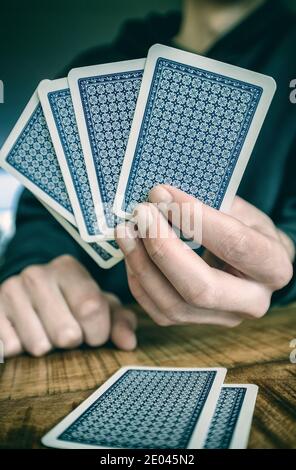 Man playing cards Stock Photo