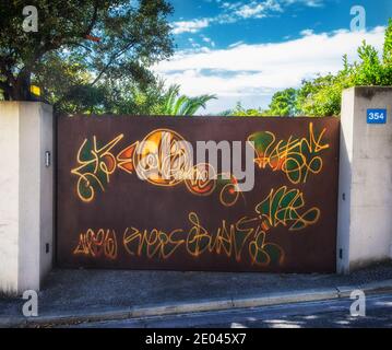 Marseille, France, Oct 2020, View of a metal rusty gate with graffiti Stock Photo