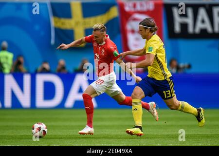 SAINT PETERSBURG, RUSSIA- 3 July 2018: Josip Drmic (L) of Switzerland vs Gustav Svensson of Sweden during the 2018 FIFA World Cup Russia Round of 16 m Stock Photo