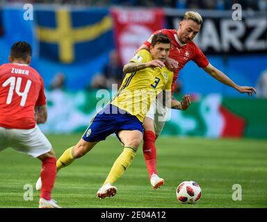 SAINT PETERSBURG, RUSSIA- 3 July 2018: Victor Lindelof (L) of Sweden vs Josip Drmic of Switzerland during the 2018 FIFA World Cup Russia Round of 16 m Stock Photo