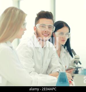 close up.a team of scientists use a computer to check the data Stock Photo