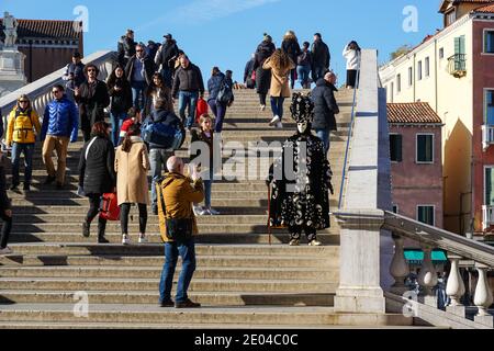 Tourists on Ponte degli Scalzi bridge in Venice, Italy Stock Photo