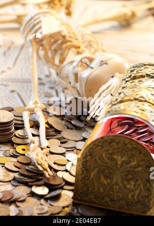 Skeleton of a greedy Pirate who found a treasure chest Stock Photo