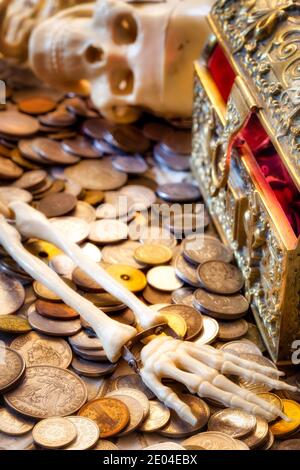 Skeleton of a greedy Pirate who found a treasure chest Stock Photo