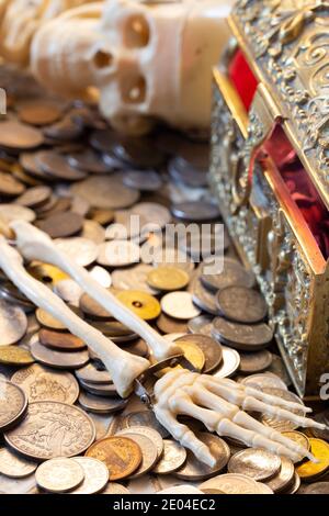 Skeleton of a greedy Pirate who found a treasure chest Stock Photo