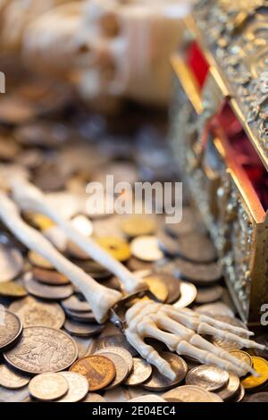 Skeleton of a greedy Pirate who found a treasure chest Stock Photo