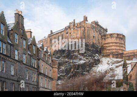 View of Edinburgh Castle from the Grassmarket on a December morning after anovernight snowfall. Stock Photo