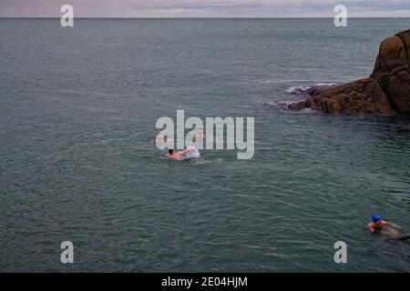 Winter Swimmers. Sandycove Forty Foot bathing area Dun Laoghaire near Dublin, Ireland, 27 December. Stock Photo