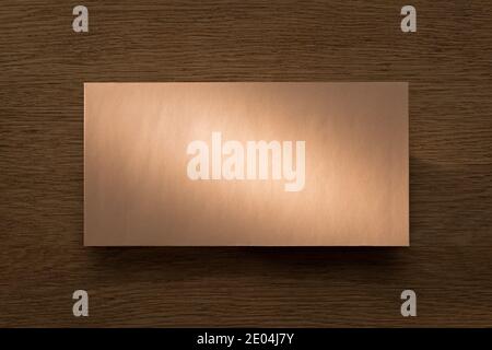 Letter above oak desk in beam of warm light Stock Photo
