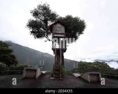 Famous swing at the end of the world at Casa del Arbol tree house near Banos Tungurahua volcano in Ecuador Stock Photo