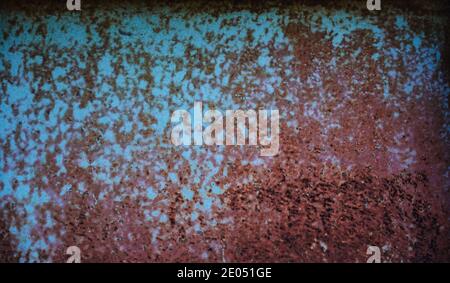 Old rusty and scratched metal wall, grunge texture with brown and greenish blue colors. Can be used as background. Stock Photo